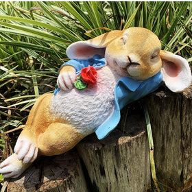 iRonrain rabbit lying posture statue enhances intimate backyard ambiance.