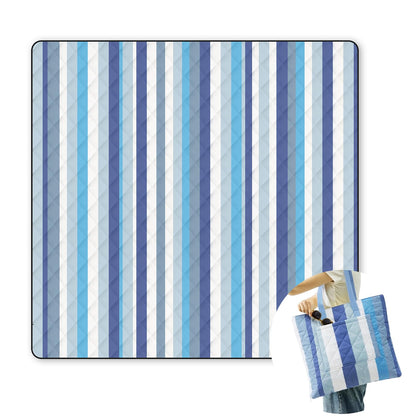 Jactum 2-in-1 tote picnic blanket laid out on grass, providing ample seating.