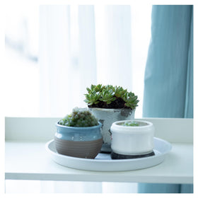 JAKOUE raised grid design lifts pots for airflow and mess reduction.