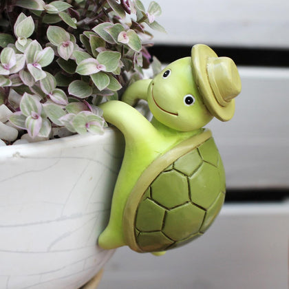 JARPSIRY cute cartoon tortoise pot hugger on a planter edge adds whimsy