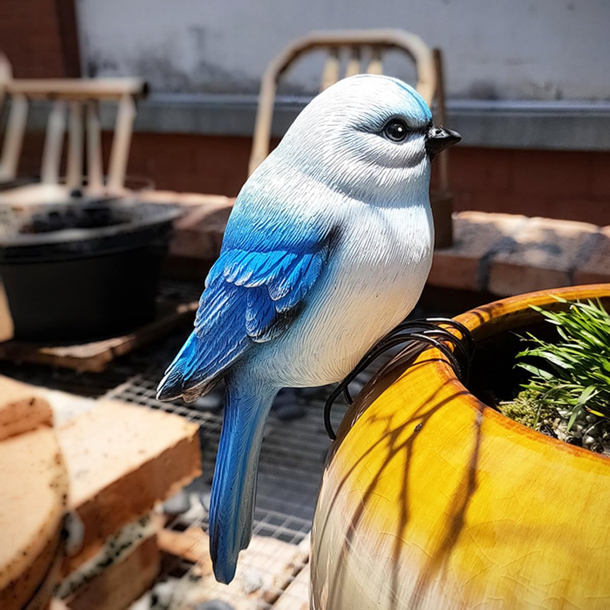 Jarpsiry resin bird figurine offers durable outdoor decor.