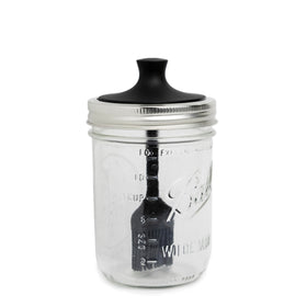 Jarware silicone black basting brush lid on a wide-mouth jar for precise sauce application.