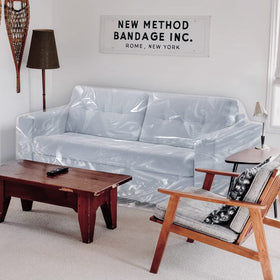 Transparent Jassoka plastic cover preserves sofa appearance while protecting it