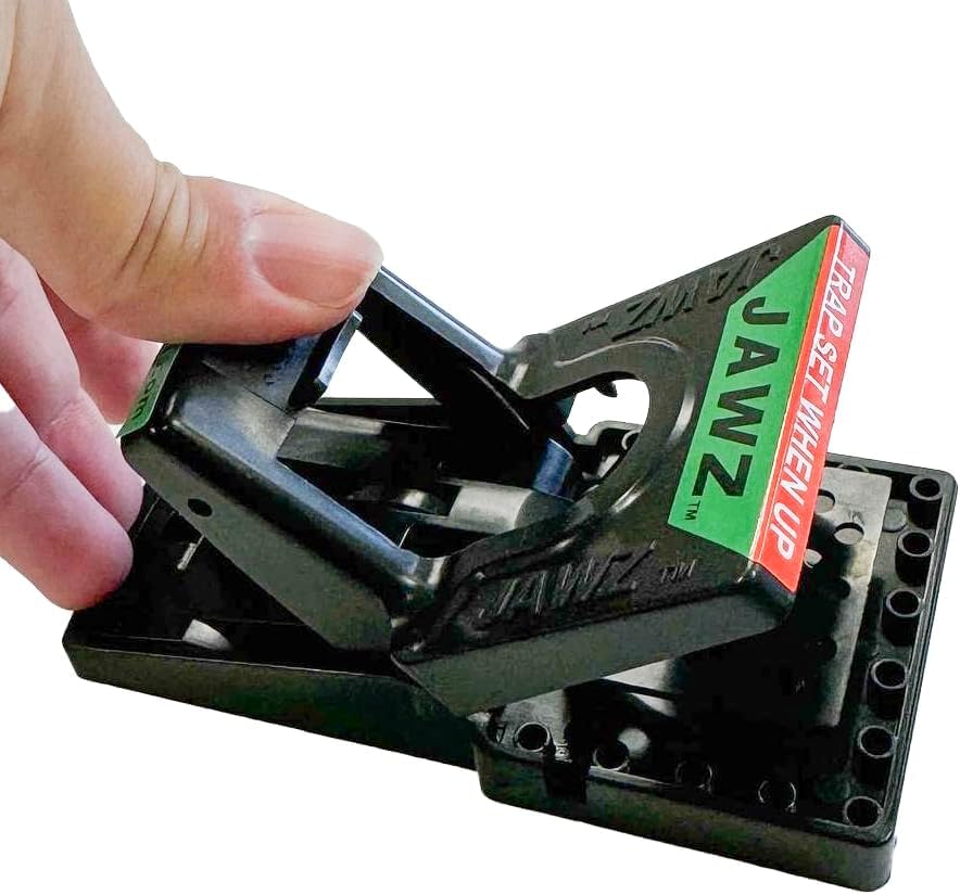 JAWZTM trap being set with foot to avoid finger contact