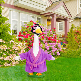 JcHrmers purple old-lady goose outfit enhances curb appeal of garden statues.