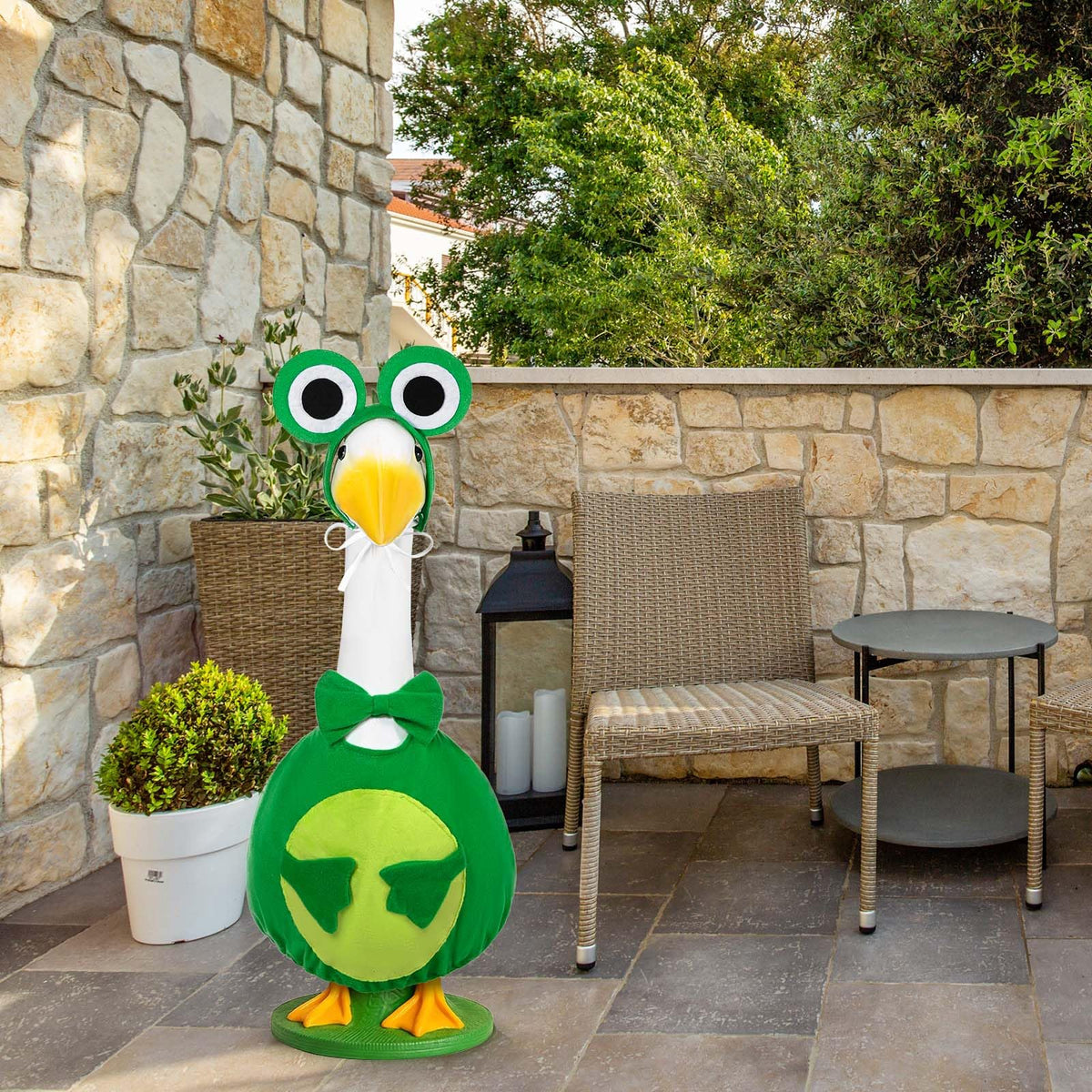 JcHrmers frog-costume-for-outdoor-goose keeps the statue looking fresh.