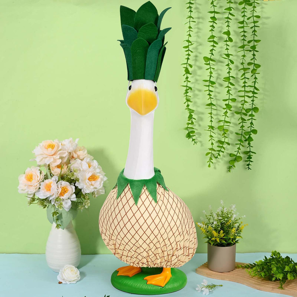 JcHrmers pineapple-themed goose attire brightens lawn and patio space