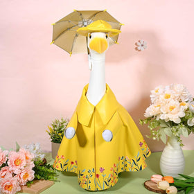 JcHrmers spring party setup with a dressed goose statue.