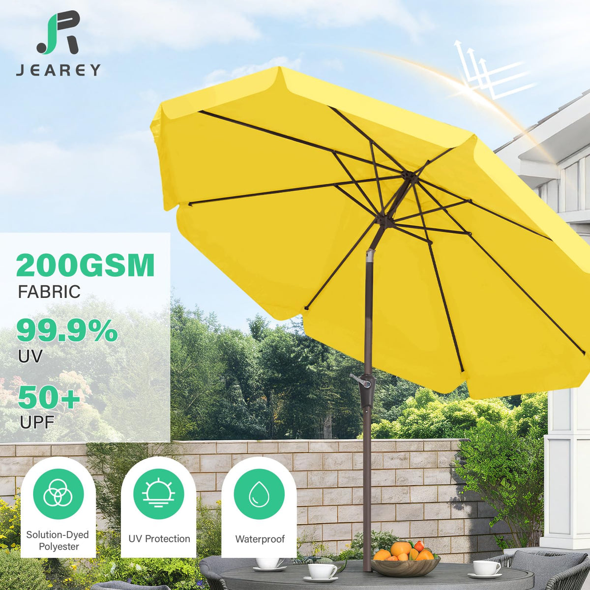 JEAREY patio umbrella shading a large table in outdoor space.