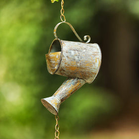 Jemeni rain bell with verdigris finish offers year-round outdoor appeal.