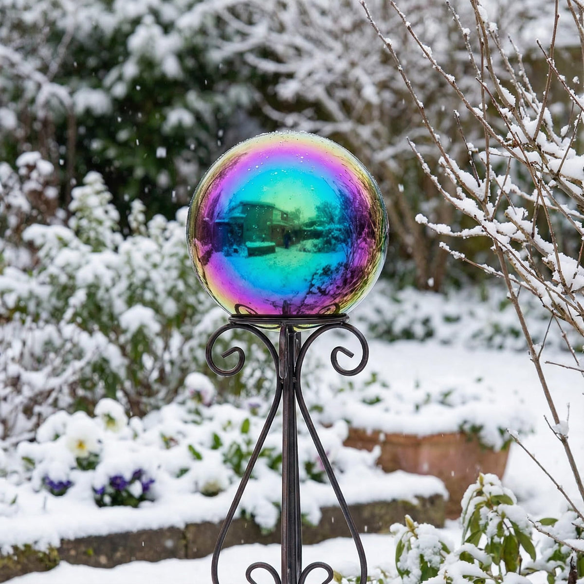 JforSJizT rainbow gazing ball indoors adds a stylish living space accent.