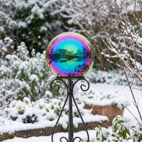 JforSJizT rainbow gazing ball indoors adds a stylish living space accent.