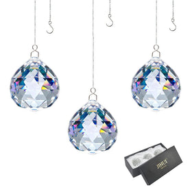JIHUI crystal prism ball 30mm catching light to create colorful rainbows.