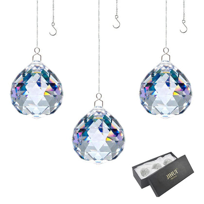 JIHUI crystal prism ball 30mm catching light to create colorful rainbows.