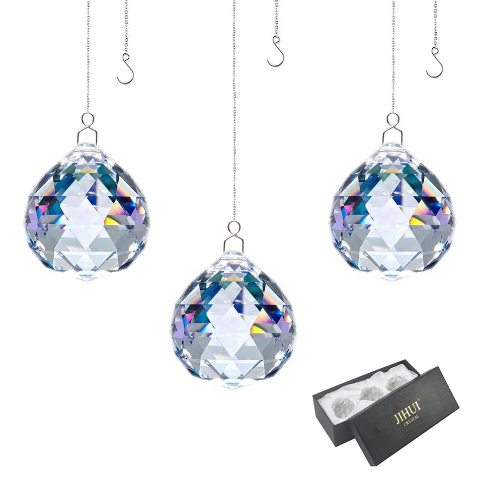 JIHUI crystal prism ball 30mm catching light to create colorful rainbows.