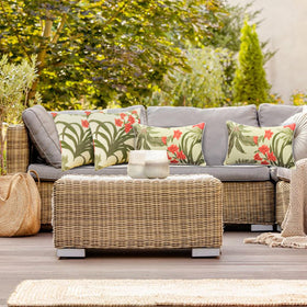 JMGBird grass-green outdoor pillow shown in a garden setup for versatile decor.