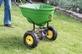 John Deere winter ice melt spreader ready for de-icing tasks