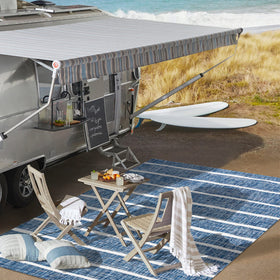 JONATHAN Y Berber Stripe rug resists fading while maintaining color in outdoor spaces.