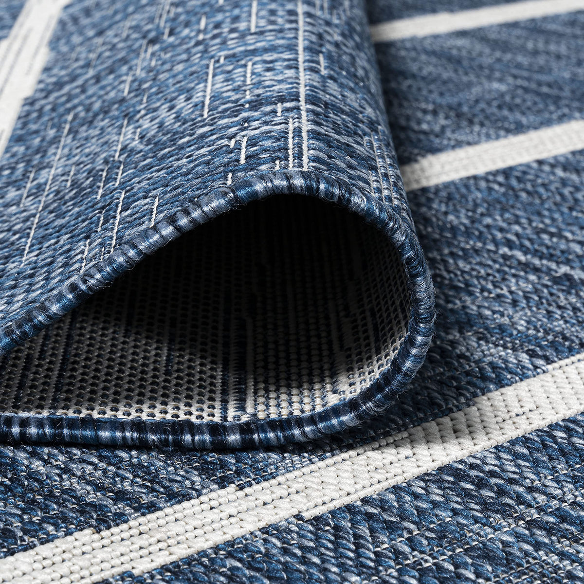 JONATHAN Y Berber Stripe rug is easy to clean with mild soap and water.