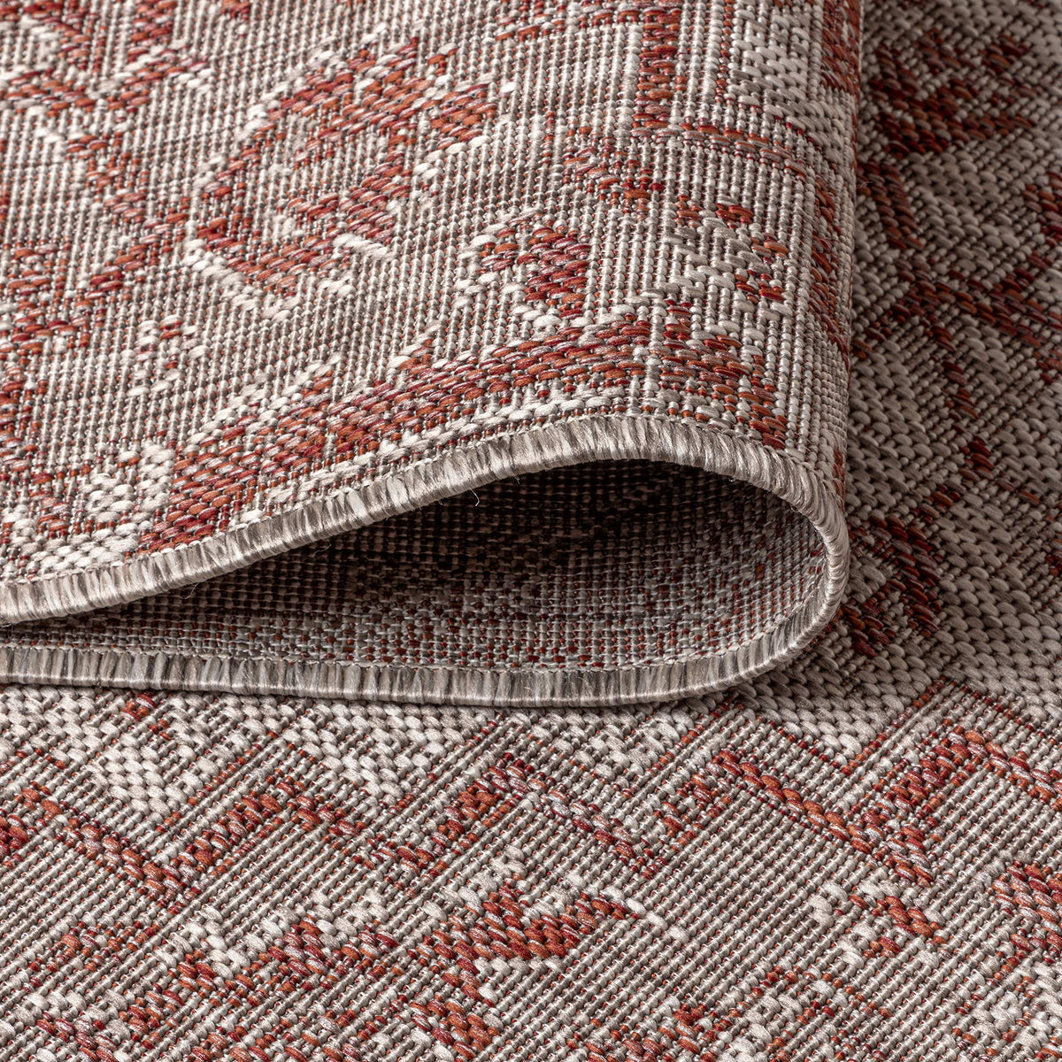 Jonathan Y red-taupe rug easy to clean and stain resistant.