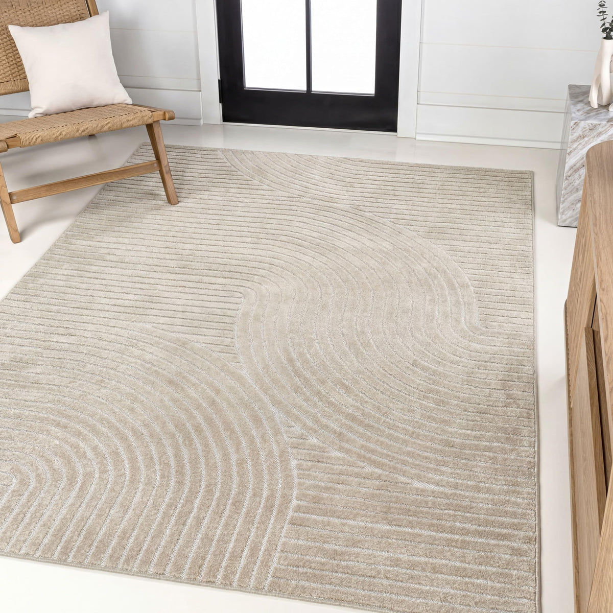 Jonathan Y Hallie high-low curve rug in beige and cream for outdoor spaces.