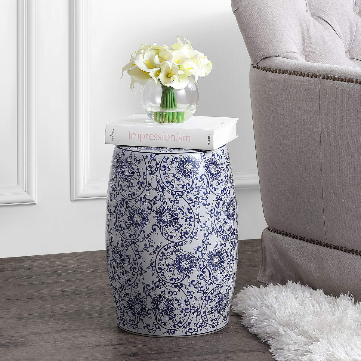 Jonathan Y Lotus Blossom ceramic drum stool with blue-and-white pattern.