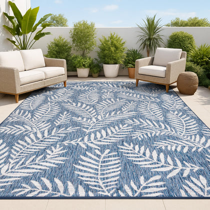 Jonathan Y palm frond pattern rug in navy and ivory for versatile indoor-outdoor use.