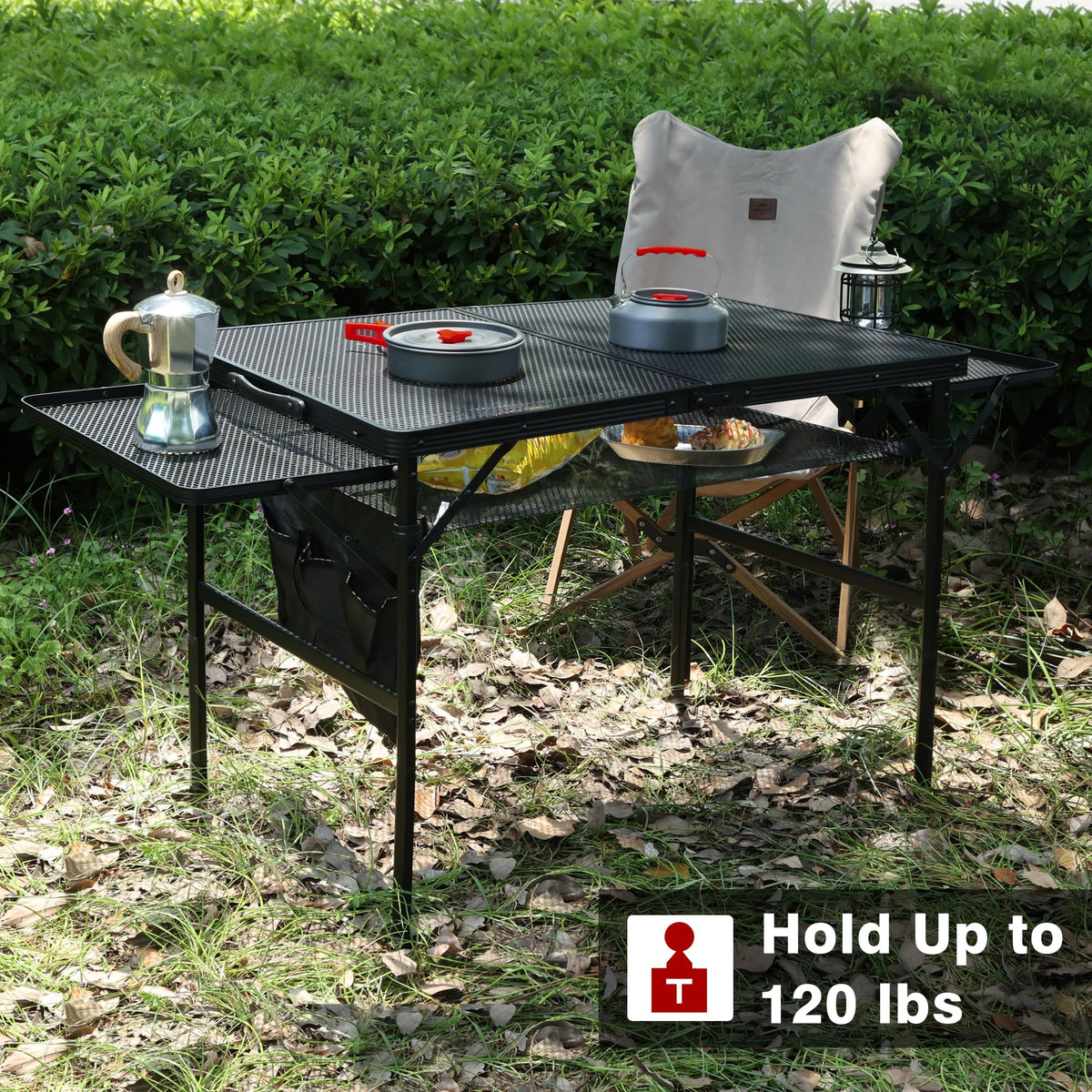 Portable JOUYEK folding grill table setup for a picnic or camp