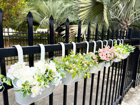 Joyfernal pair setup on porch railing adding color