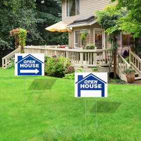 Juexica open house sign in use by a real estate agent on a lawn.