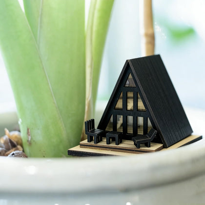 JULEASEL front-deck view of the modern black A-frame cabin for fairy gardens