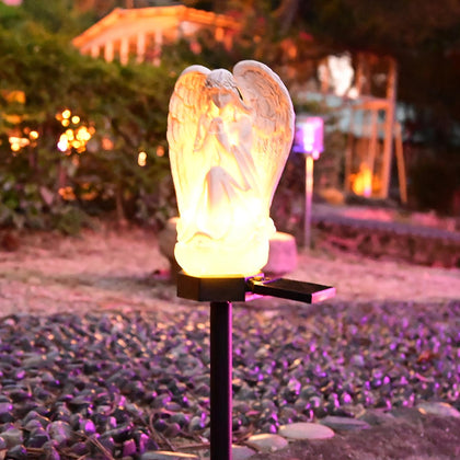 Juliahestia guardian angel solar light garden statue glowing at dusk