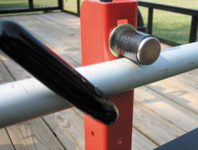 Jungle Jim's 3TR trimmer rack installed on enclosed trailer for weather-protected transport.
