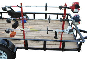 Jungle Jim's 3TR trimmer rack on an open trailer demonstrates easy loading and secure mounting.