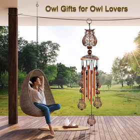 JUNQIU Owl Wind Chimes on patio offer peaceful outdoor soundscape.