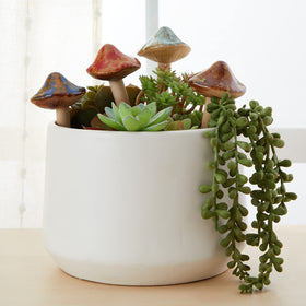 Juvale orange mushroom stake complements porch planters with cheerful color