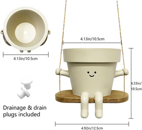 Jxcnkiy smiley face planter in resin designed for sun and rain resistance.
