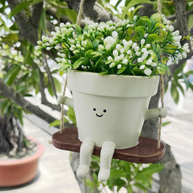 Jxcnkiy smiley face planter ideal for succulents and trailing plants.