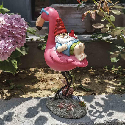 Jy.Cozy gnome reclining on flamingo statue adds tropical whimsy to outdoor spaces