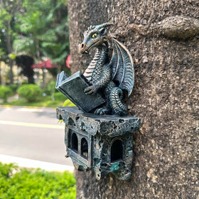 Jy.Cozy dragon close-up reveals black resin with lustrous gold accents