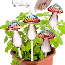 Kaimfdg mushroom watering globe with rainbow finish enhances indoor plant decor.