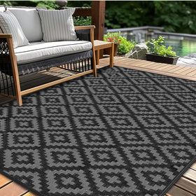 Kalafun outdoor patio rug 5x8 waterproof on deck adds comfort and quick-dry convenience.
