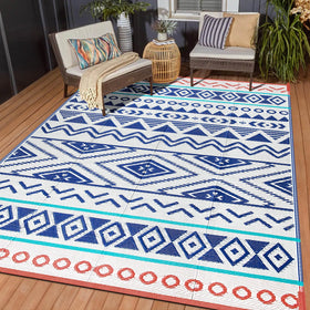 Kalafun outdoor rug 6x9 ft on a sunny patio, waterproof and easy to clean.