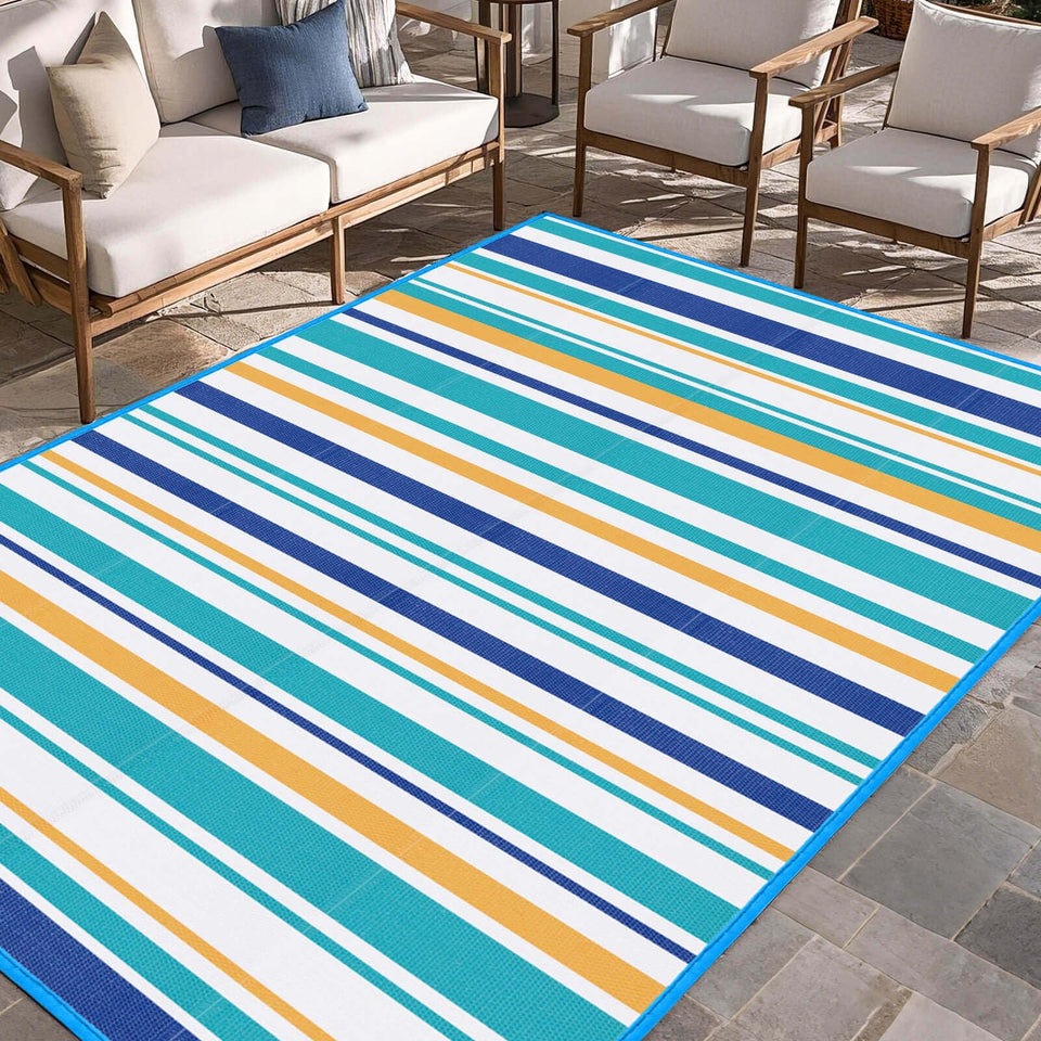 Kalafun outdoor rug blue and yellow 5x8 on porch adds cozy, durable color for gatherings.