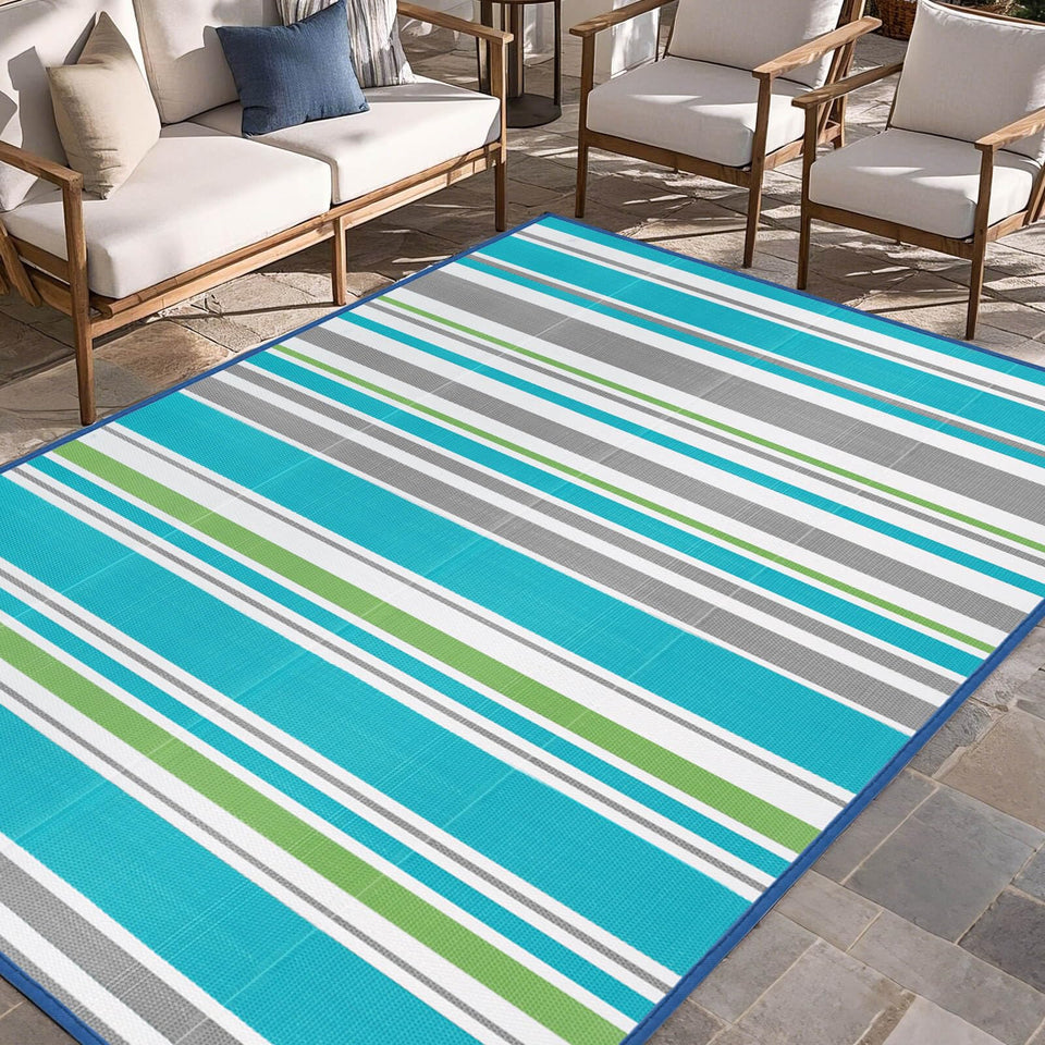 Kalafun outdoor rug in turquoise-grey for patios, durable and easy to clean.