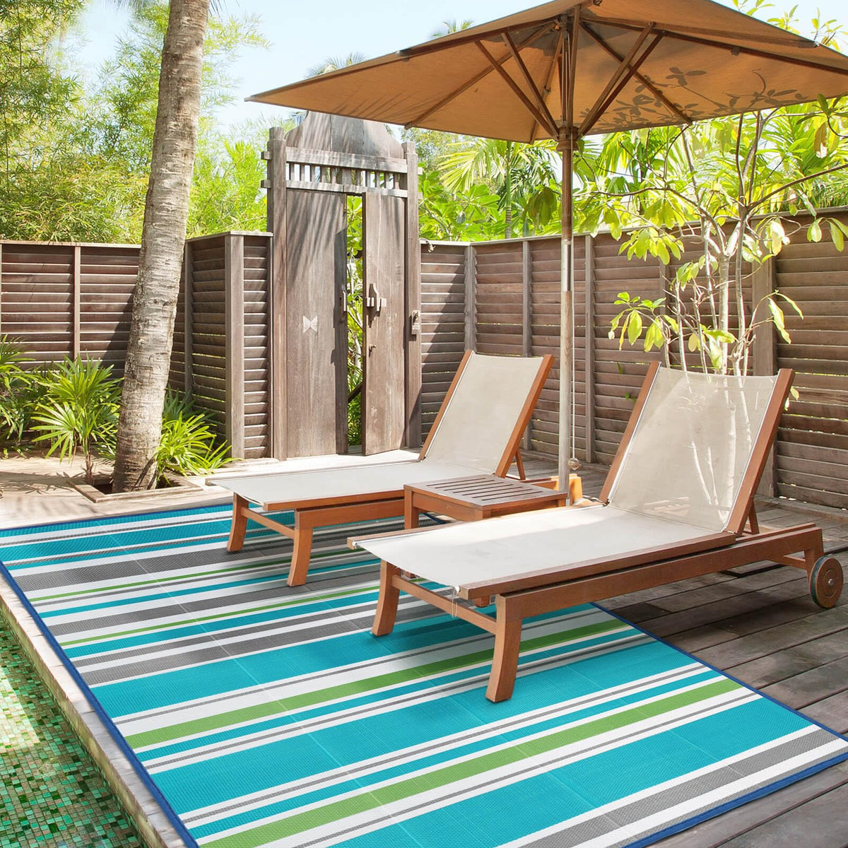 Kalafun waterproof rug in turquoise-grey, ideal for decks and balcony areas.