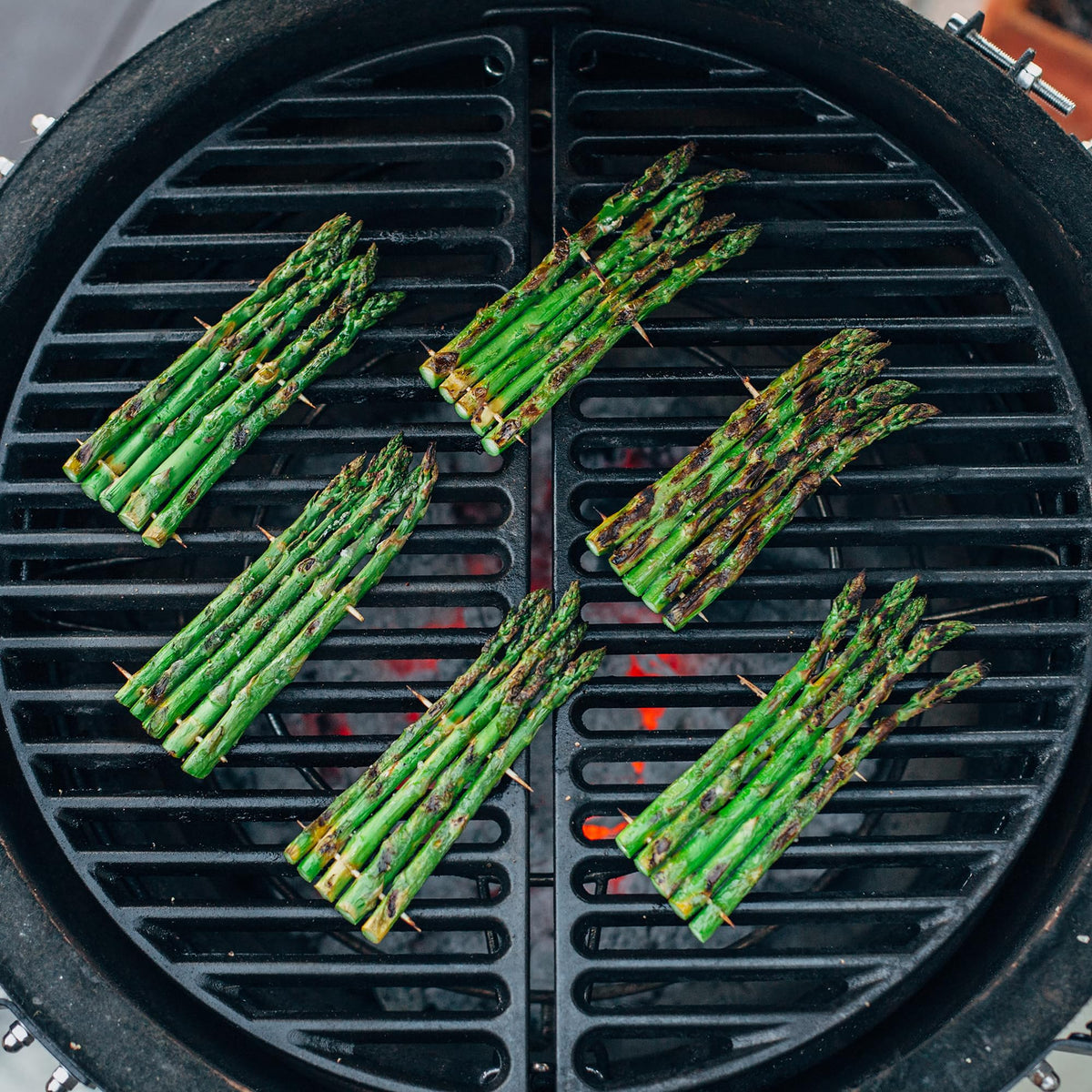 Kamado Joe cast iron lifting tool for safe, hot-grate handling during cooking.