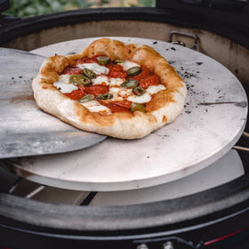 Kamado Joe heat deflector in use with KJ-PS23 protects pizza from burning