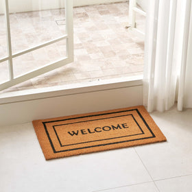 KANKUN Welcome mat texture close-up highlighting durable natural coir fibers for dirt removal.