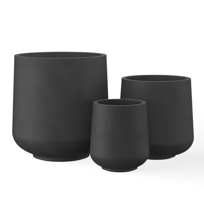 Kante 15.3-inch round concrete planter in black showing its large, sculptural form